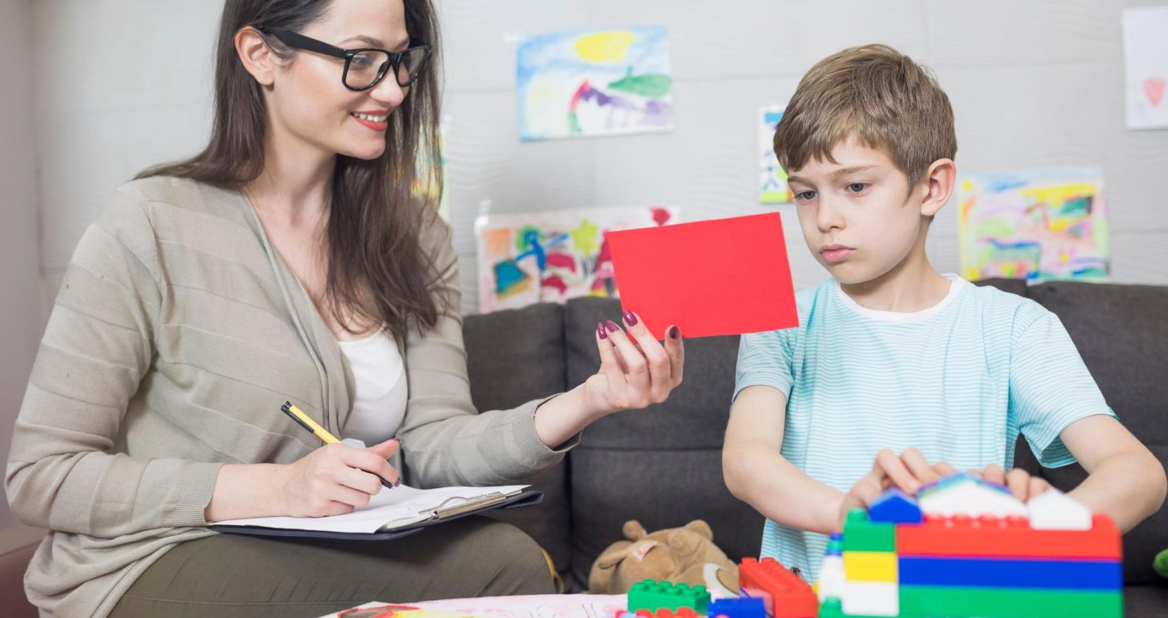 Educational psychologist working with a child
