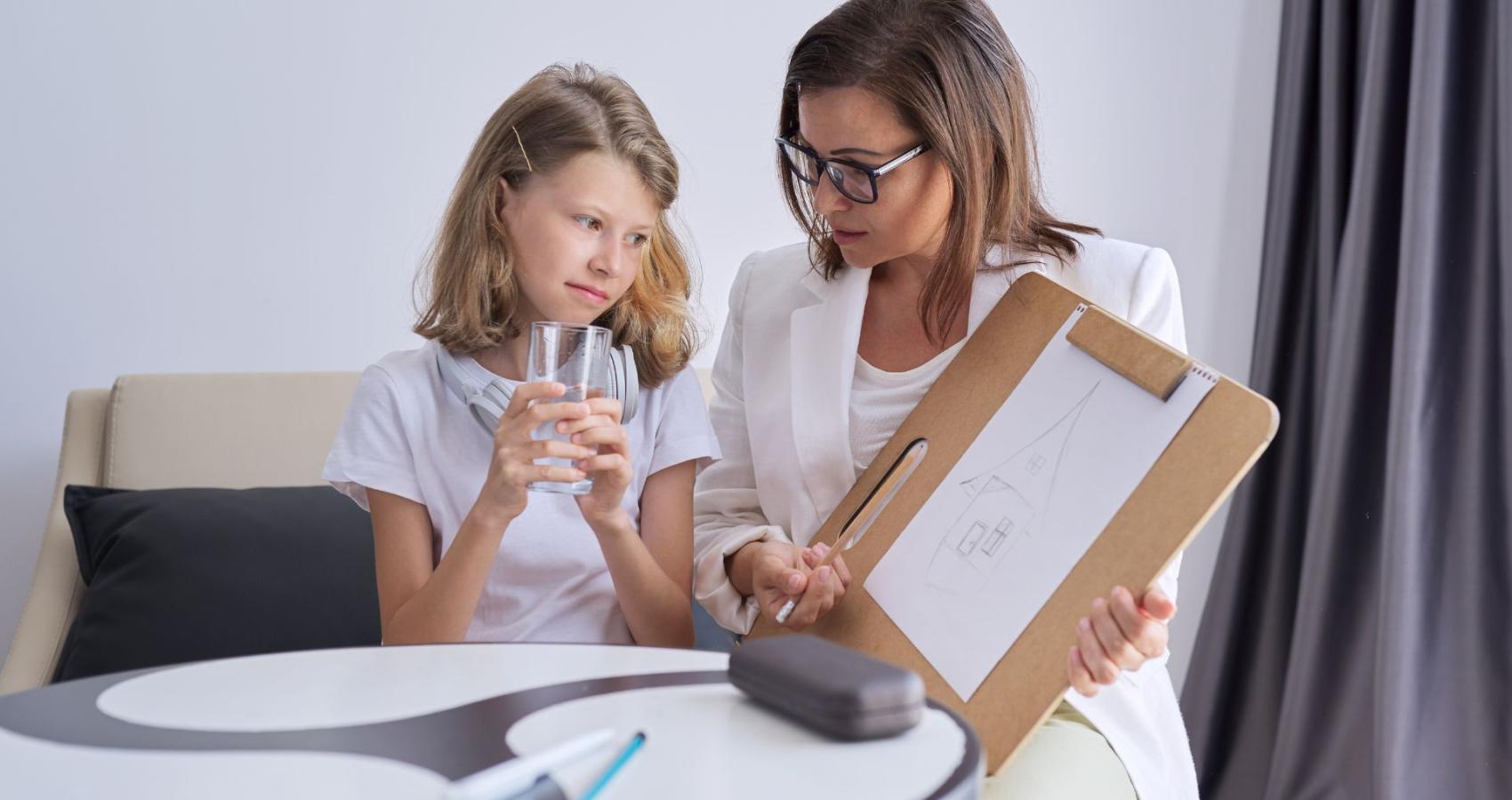 Educational psychologist working with a child