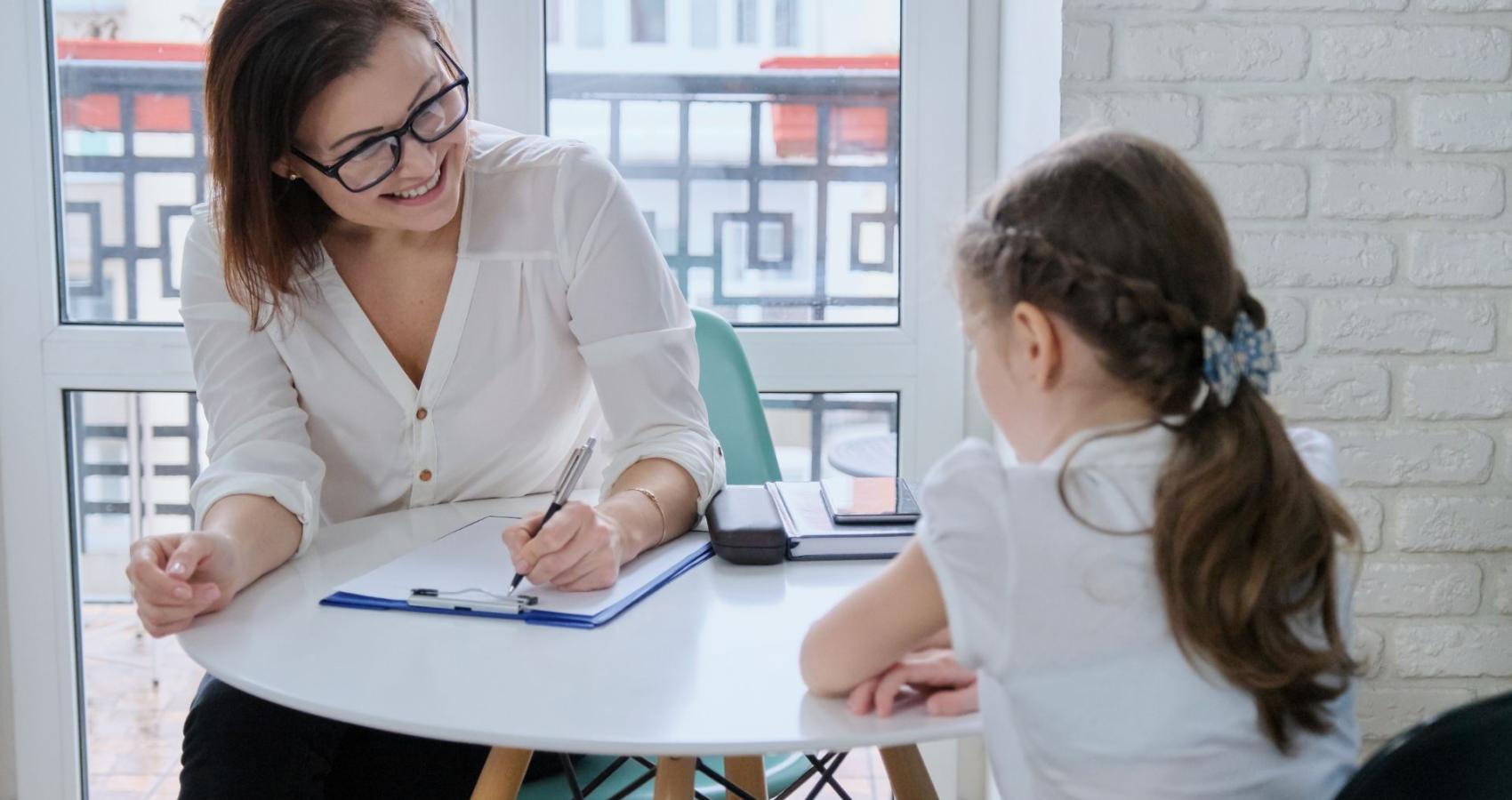 Educational psychologist working with a child