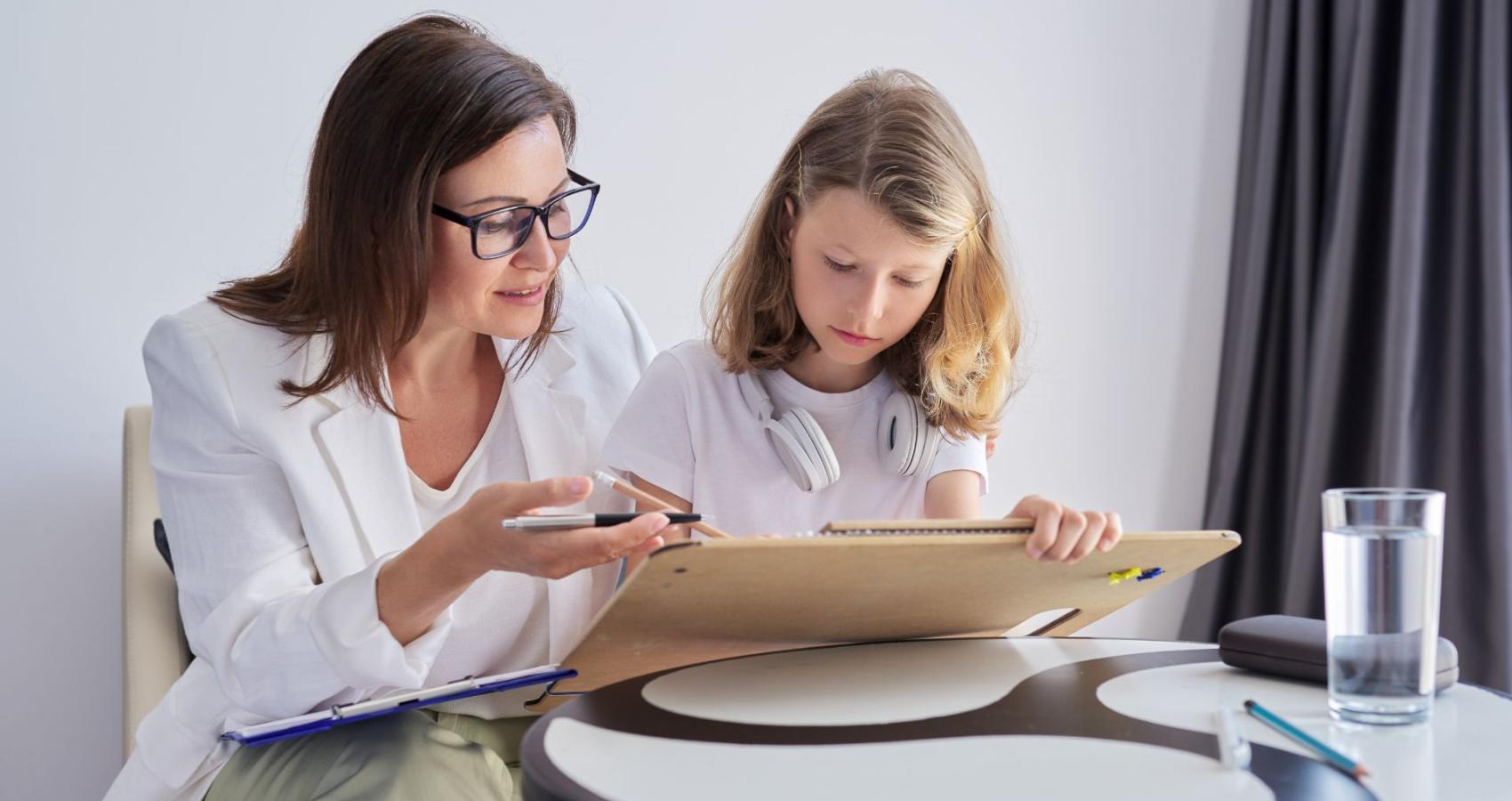 Educational psychologist working with a child