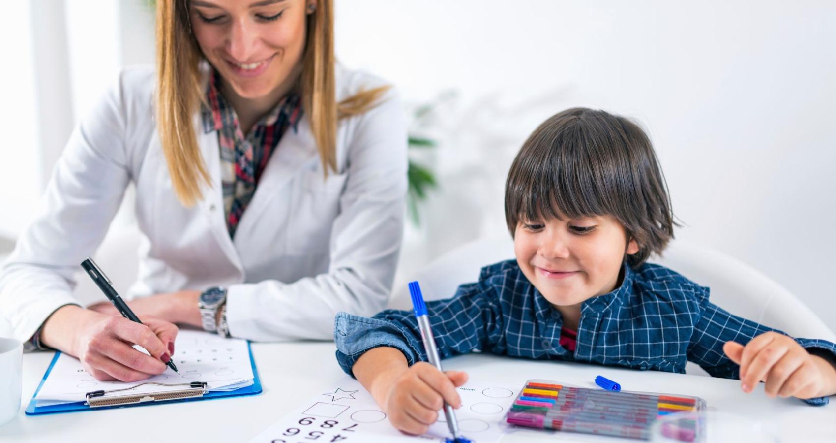 Educational psychologist working with a child