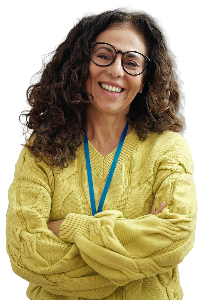 A person wearing a yellow jumper and glasses is smiling
