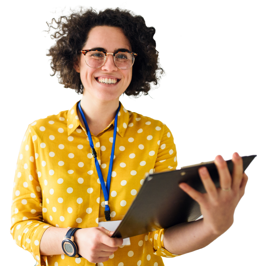A person wearing a yellow shirt with white spots is smiling and holding a clipboard