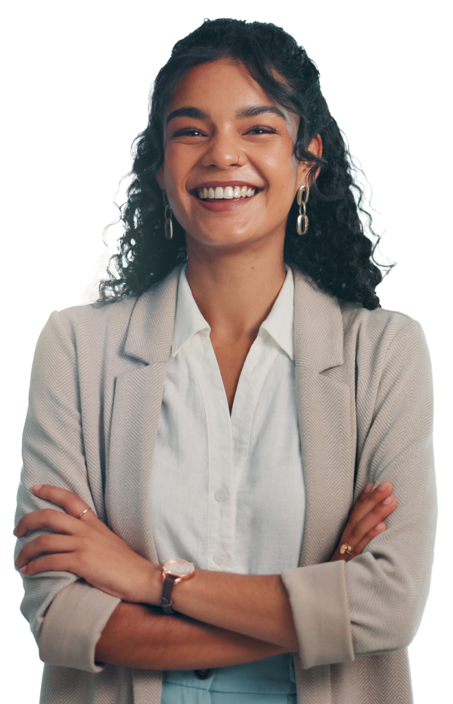 A person wearing a white shirt and beige blazer is smiling and folding their arms