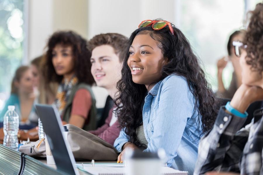 Students smiling in a classroom