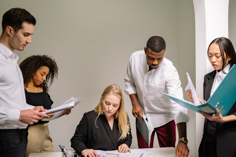 A group of adults looking at pieces of paper
