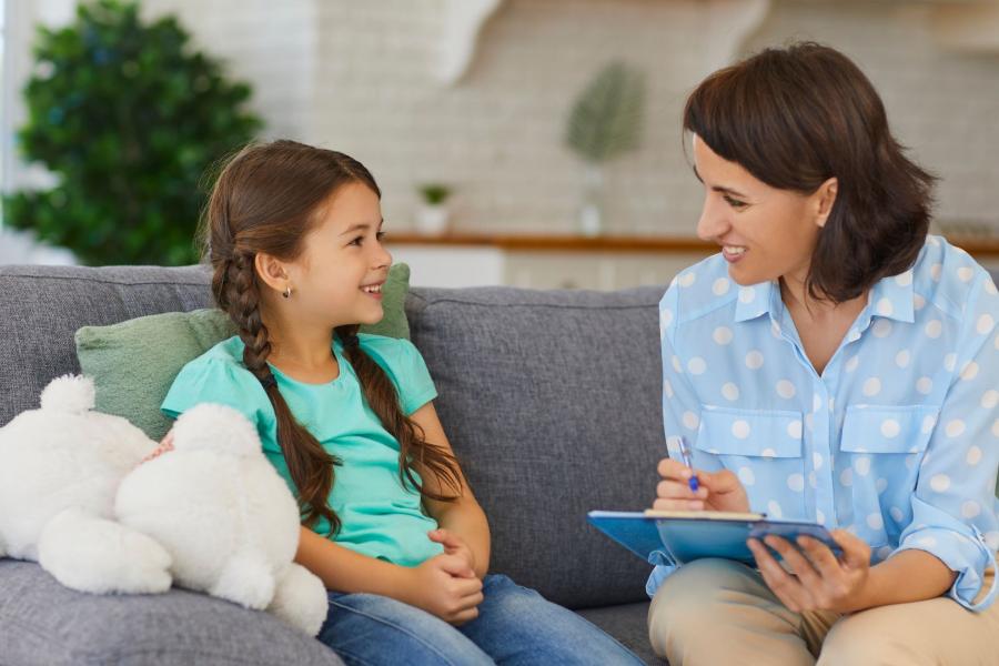 An adult speaking to a young child