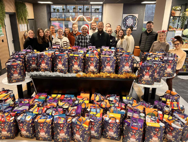 Spencer Clarke Group employees stood by Christmas food parcels