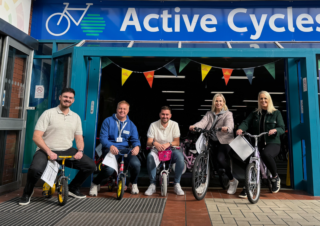 Spencer Clarke Group employees sat on bikes