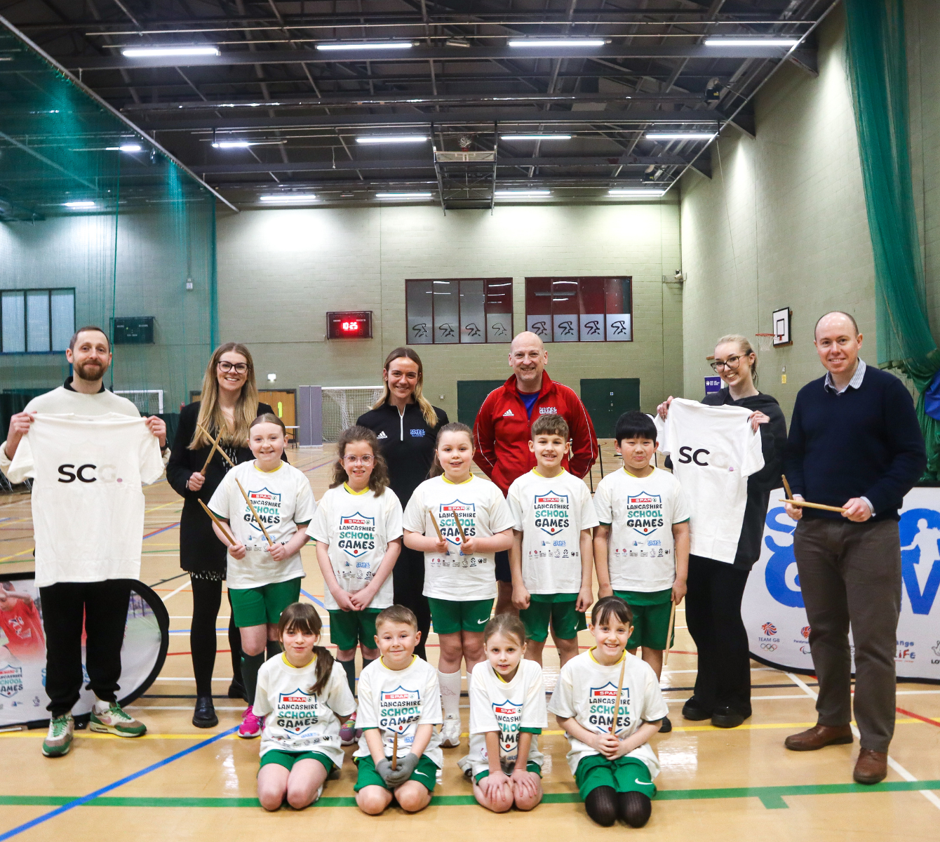 Spencer Clarke Group employee, adults and school children at a drumba sports event